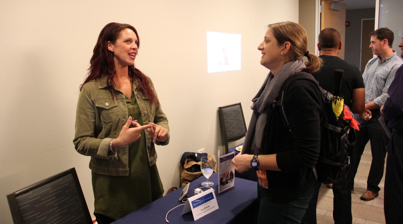 Two grad students having a conversation 