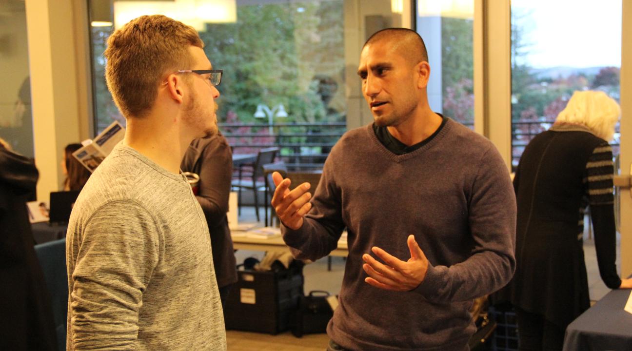Two men having a conversation 