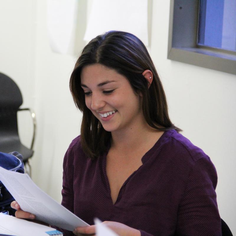Graduate Studies student smiling in classroom