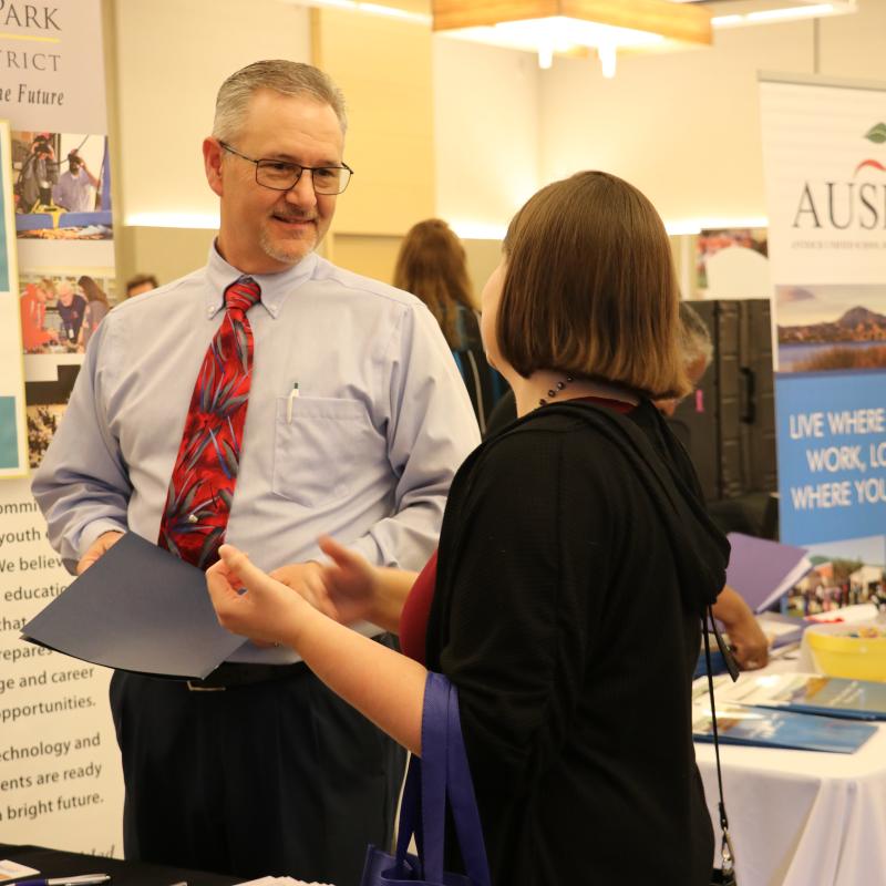 Educators talking in a poster session